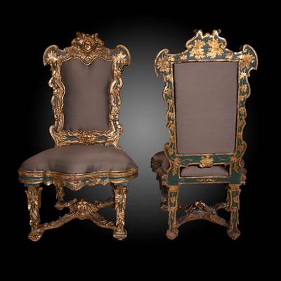 An exceptional pair of gilded, carved wood and painted chairs, with a vegetal and 